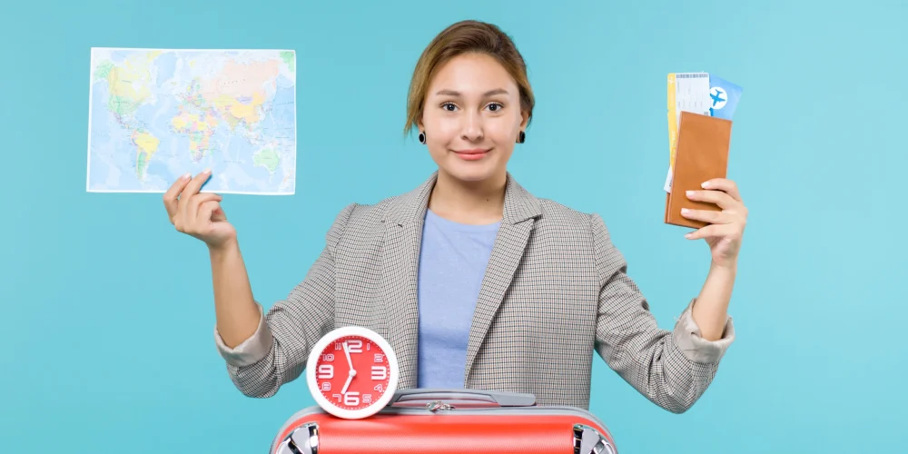 female holding map tickets tourist visa