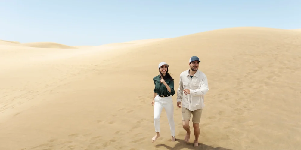 Couple enjoying desert safari Abu Dhabi