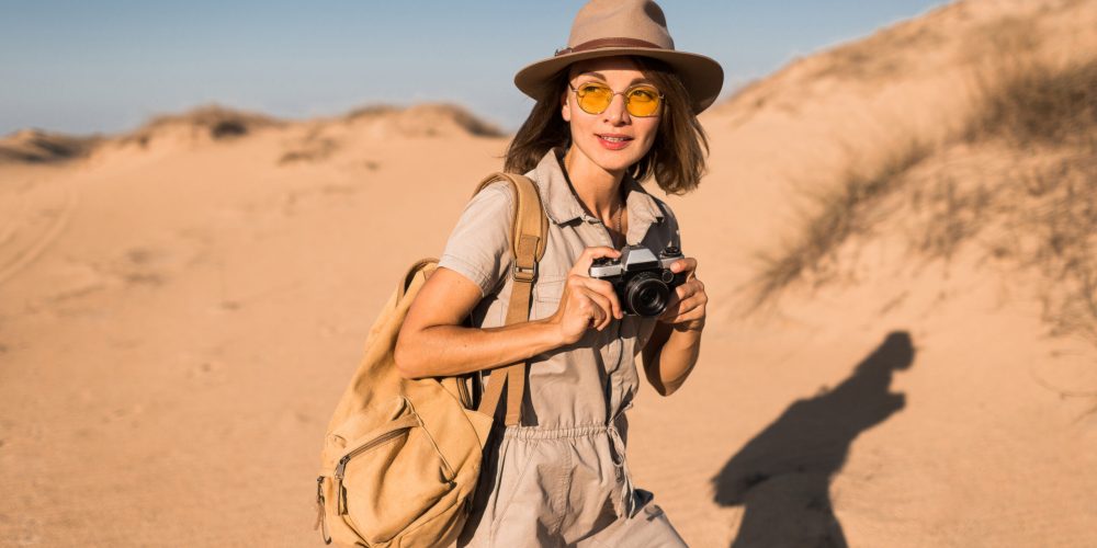 woman in desert walking on safari